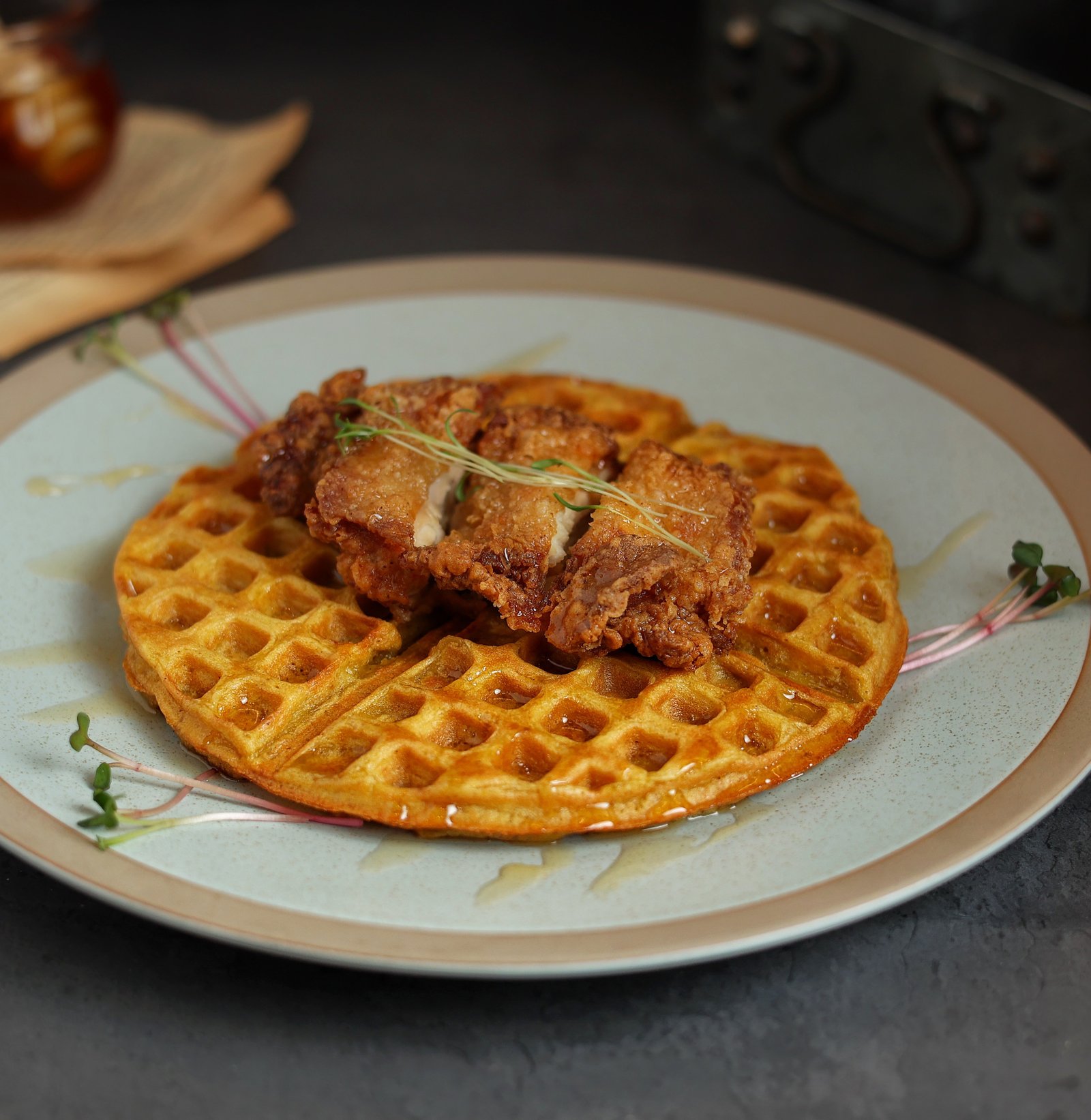 Fried Chicken on butternut waffle with a drizzle of a honey